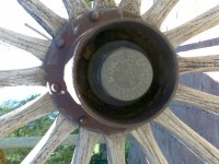 Artillery style hub with brass hubcap