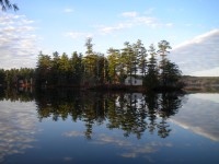 A clear view of tiny Loon Island on a perfectly calm day on Forest Lake