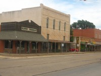 A view of Claude on U.S. Highway 287, with historic pharmacy building on the left.